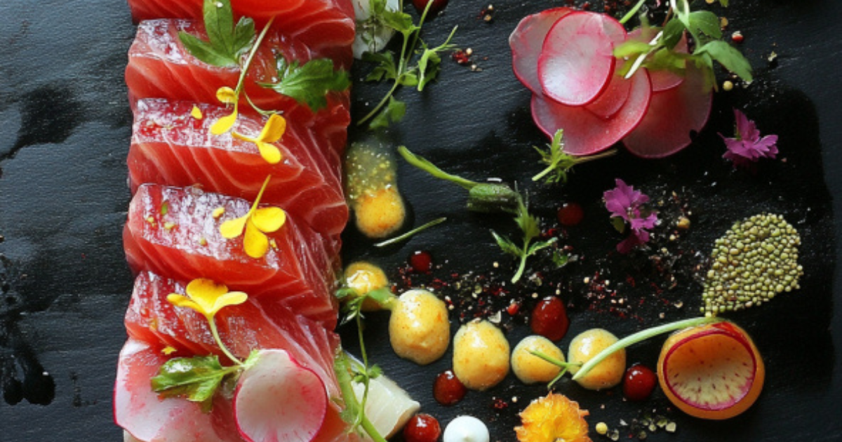 Close-up of grilled shark meat served with vegetables, showcasing its global culinary uses and regional names